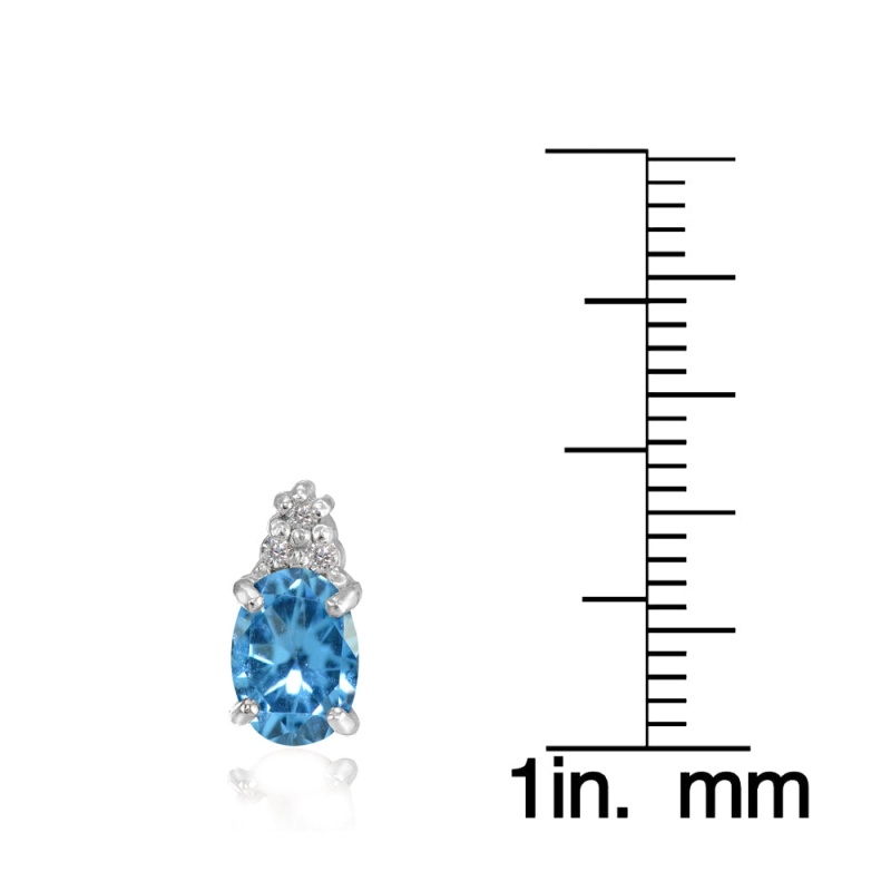 Sterling Silver Created Blue Topaz And Cz Accent Oval Stud Earrings